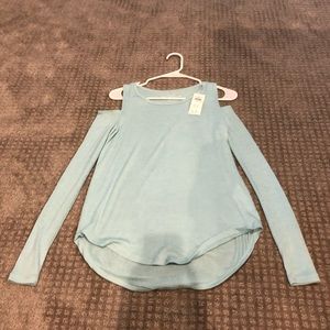 A aqua long sleeve Hollister shirt.